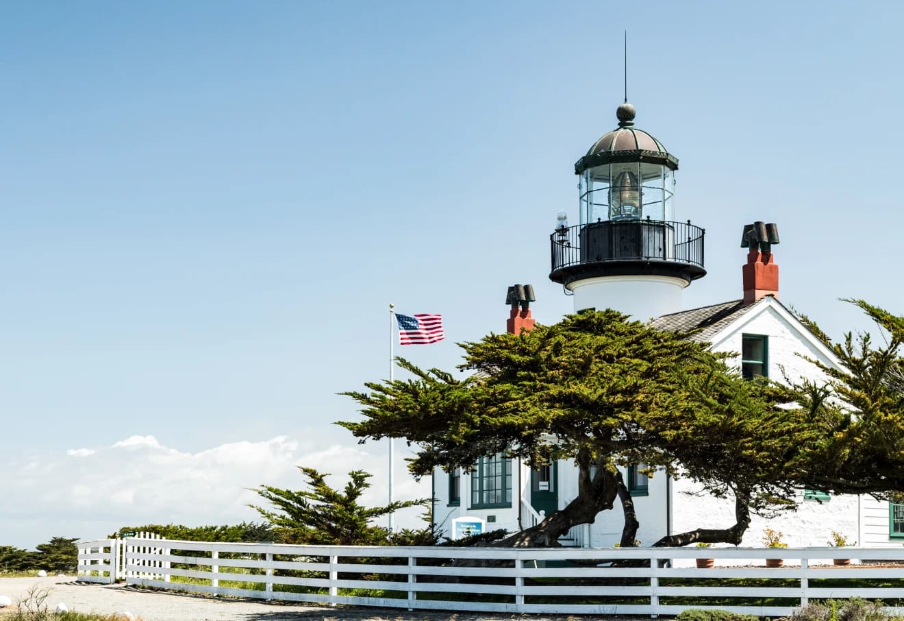 Point Pinos Lighthouse tower against a coastal sky